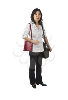 Asian women carry purse and laptop in business causal clothing on white background