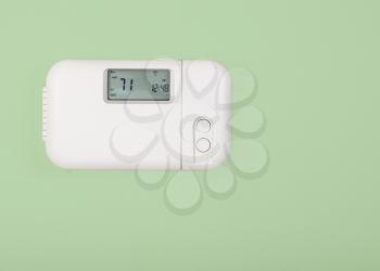 Inside home temperature thermostat set  to seventy one degrees fahrenheit