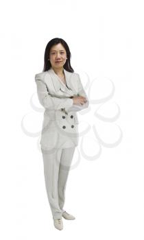 Asian woman dressed in business formal white outfit with arms crossed on white background