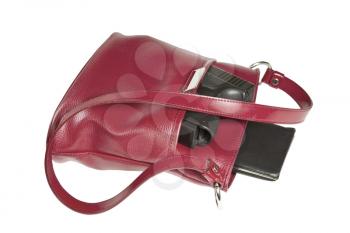 Personal weapon in red purse on white background