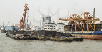 Cargo ships loaded with rare earth soil for export in China