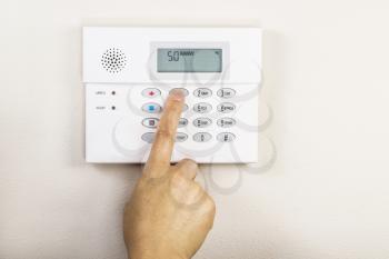 Hand setting the away code on home alarm security panel