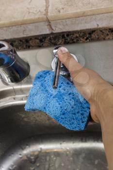 Soap Dispenser with thumb pushing lever in kitchen sink
