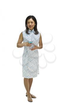 Asian Woman wearing causal dress with drink in hand on white background