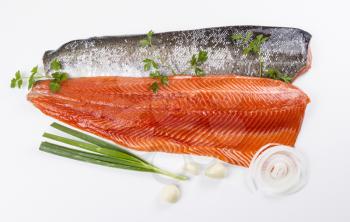 Wild Pacific Salmon Fillets with fresh herbs on White background