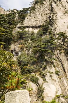 Narrow and steep staircase on yellow mountain in China