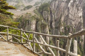 Stone and wooden fence in China's yellow mountains 