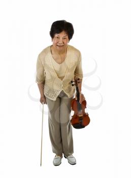 Vertical photo of a senior woman bowing after playing the violin on white background
