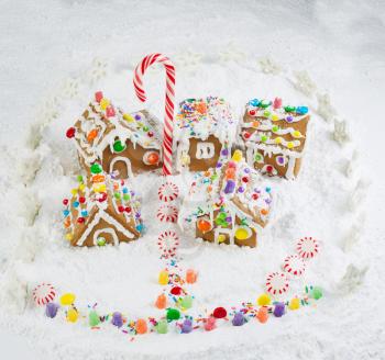 Photo of Gingerbread village with surrounding star fence and lots of powered snow