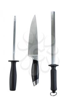 Vertical photo of single large kitchen knife and two sharpeners isolated on white 