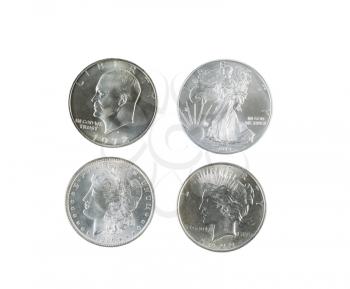 Closeup photo of a Morgan, Peace, Eisenhower and American Eagle Silver Dollars isolated white 