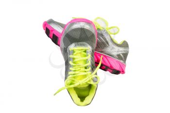 New work out shoes in bright green, silver and pink colors isolated on white 