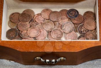 Image of antique dresser drawer filled with vintage American Indian pennies 