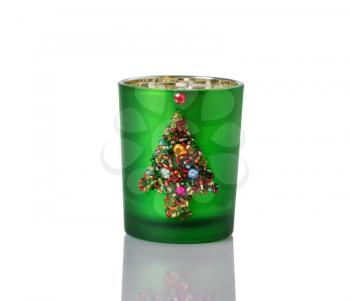 Image of handmade Christmas candle holder on white with reflection