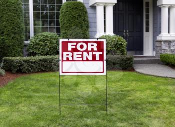 Closeup view of Modern Suburban Home with for Rent Sign in front Yard