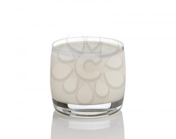 Fresh glass of milk on white background with reflection