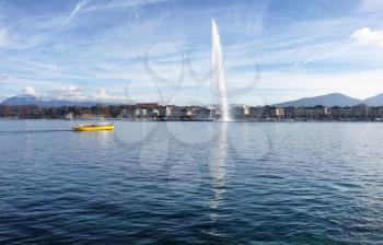 Horizontal image of Lake Geneva, Switzerland, with famous Jet d Eau fountain in background on nice autumn day 