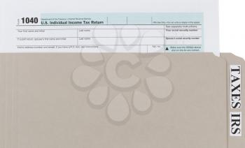 Individual income tax form inside of gray folder. Business financial concept for taxes. 