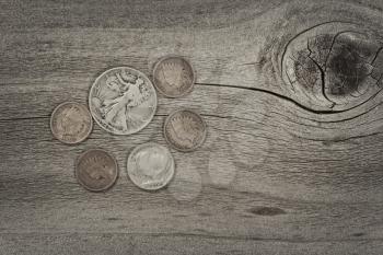 Old United States coins on rustic wood with vintage concept. Layout in horizontal format. 