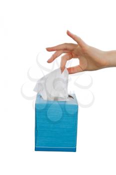 Female hand picking facial tissue from blue napkin box. Isolated on white background.