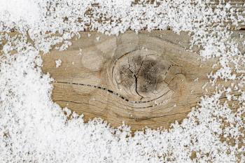 Close up of aged wood with snow. Layout in horizontal format. Winter concept for the Christmas season.   