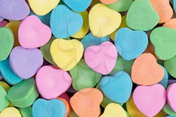 Close up of colorful heart shaped candies in filled frame format. Valentines day concept. 