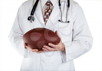 Close up front view of doctor holding football in hands on white background