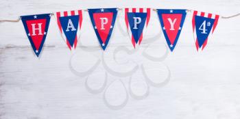 USA banner for happy Fourth of July holiday on rustic white wood.   