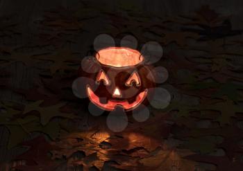 Pumpkin decoration glowing in darkness on rustic wood with autumn leaves