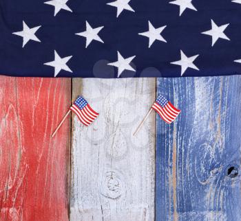 Flag of the United States of America on rustic painted boards in national colors. 