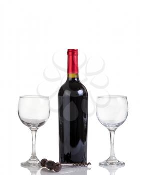 Red wine bottle and drinking glasses isolated on white with reflection