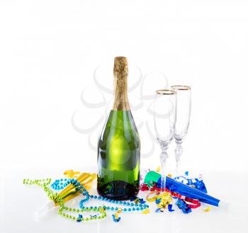 New Year party decorations and champagne on glass table with bright background 