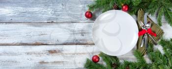 Holiday Christmas Dinner setting on rustic table 

