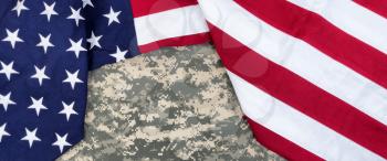 Red, white and blue American flag surrounding military uniform for Memorial Day or Veteran Day backgrounds