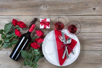 Valentine  Dinner table setting on rustic wood in flat lay view