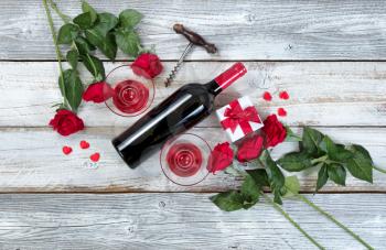 Red wine for Valentines Day on rustic white wood