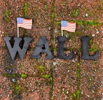 Red grunge brick stone with metal letters and United States flag for border wall concept