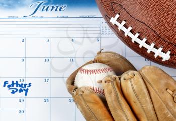 Fathers Day holiday marked on calendar with sports stuff   