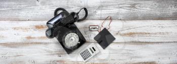Vintage technology includes rotary dial phone and old data storage devices
