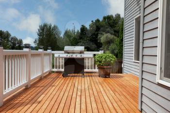 Outdoor home deck with bbq cooker and basil herbs