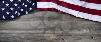 United States of America flag forming upper border on rustic wooden boards 