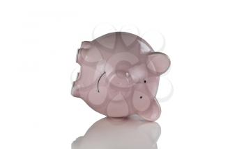 Tipped over piggy bank for Financial crisis concept. Isolated on white with reflection. 