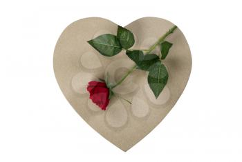 A large cardboard heart giftbox with red rose on top for Happy Valentines Day isolated on a white background