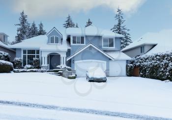 Curbside view of home after recent snowfall in pacific northwest of United States 