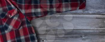 Plaid shirt on vintage wooden planks for Fathers Day Concept 