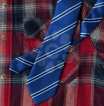 Filled frame of plaid shirt with blue necktie for Fathers Day Concept background 