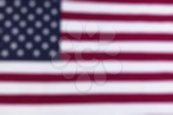Blurred abstract background of stars and strips of US American flag 