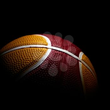 Close-up of a basketball isolated on black background