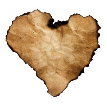 Burned heart-shaped paper isolated on white.