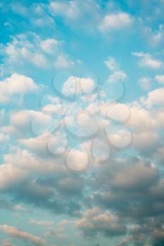Clouds sky sunset background, vertical orient.